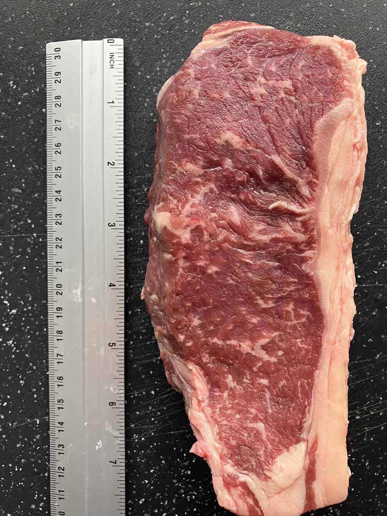 The length of a strip steak averages around 8 inches