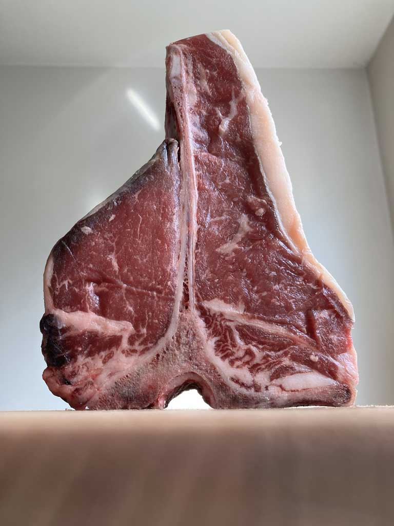 raw porterhouse steak closer look